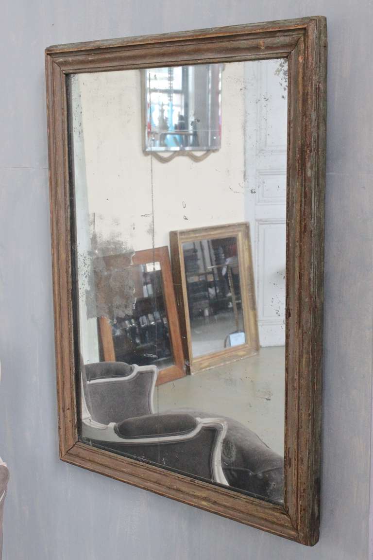 French mirror with the original distressed mercury glass and weathered frame. The back is also the original 