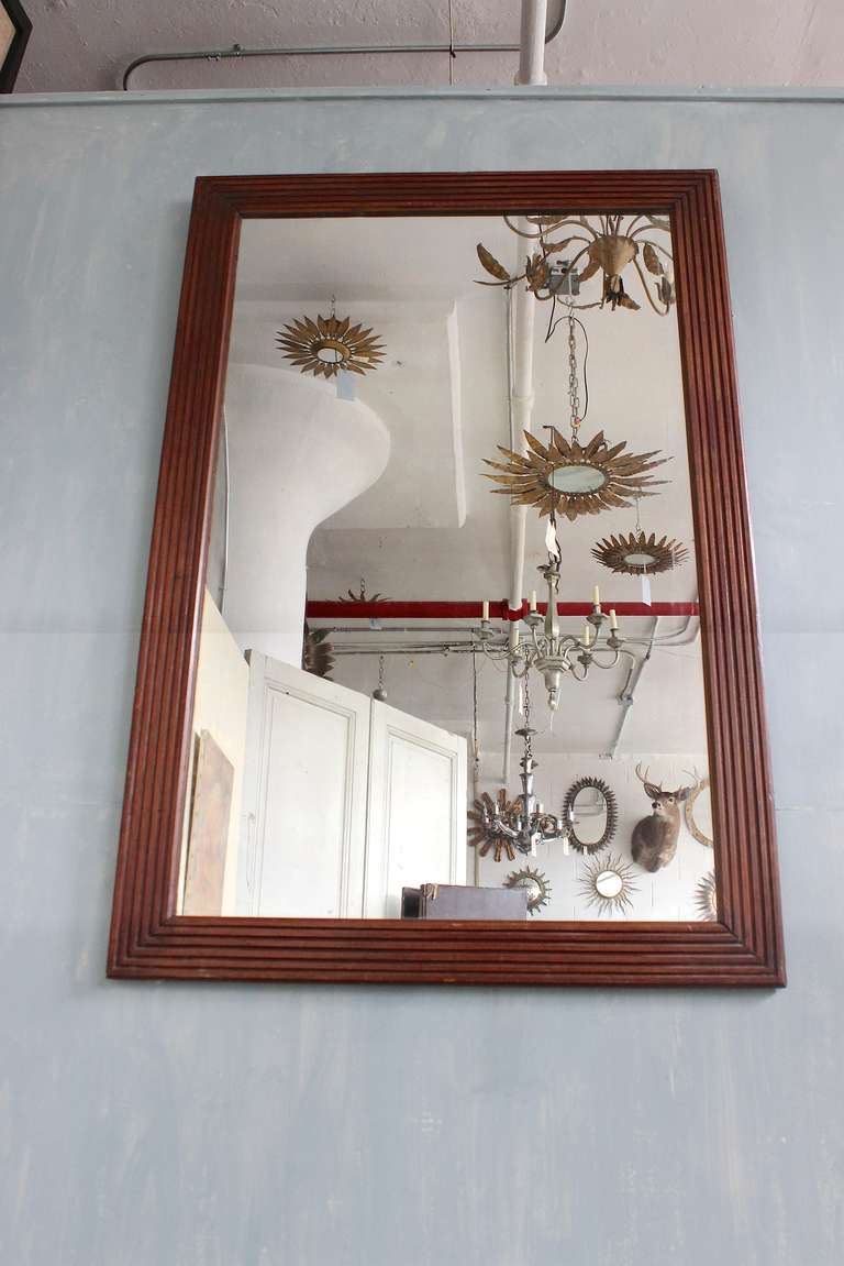 Elegant French 19th century mirror in a mahogany fluted frame. Good condition.

Ref #: DM0311-08

Dimensions: 48”H x 32