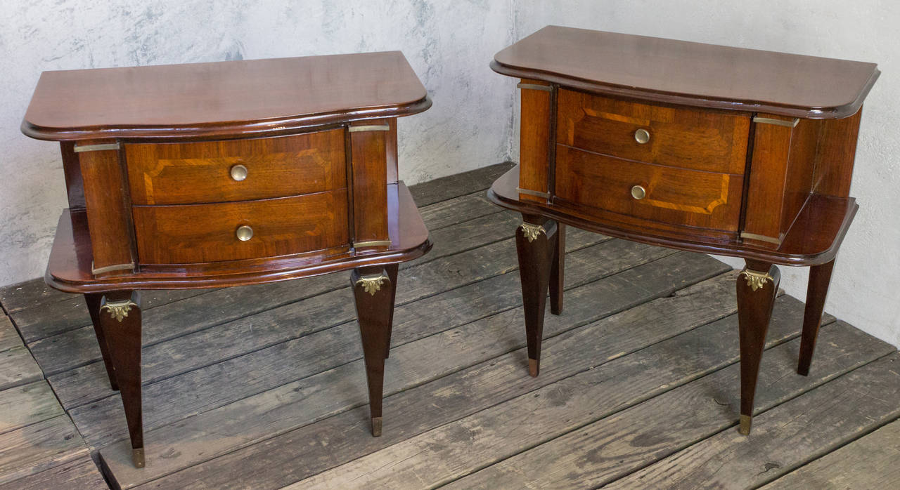 Pair of French 1940s rosewood bedside tables with bronze decorations. Rosewood with sycamore inlays.