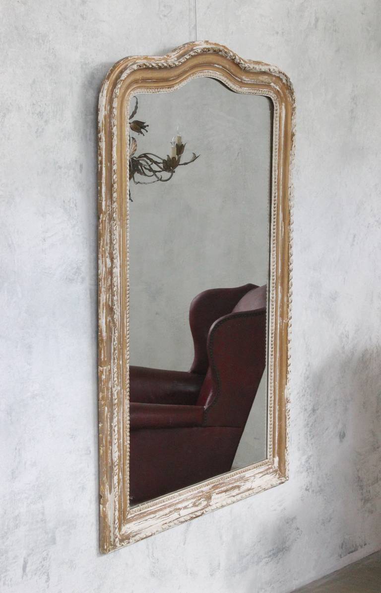 French 19th century Louis Phillipe mirror with traces of gilding. Good vintage condition, wear appropriate with age.

Ref #: DM0311-02

Dimensions: 60”H x 37