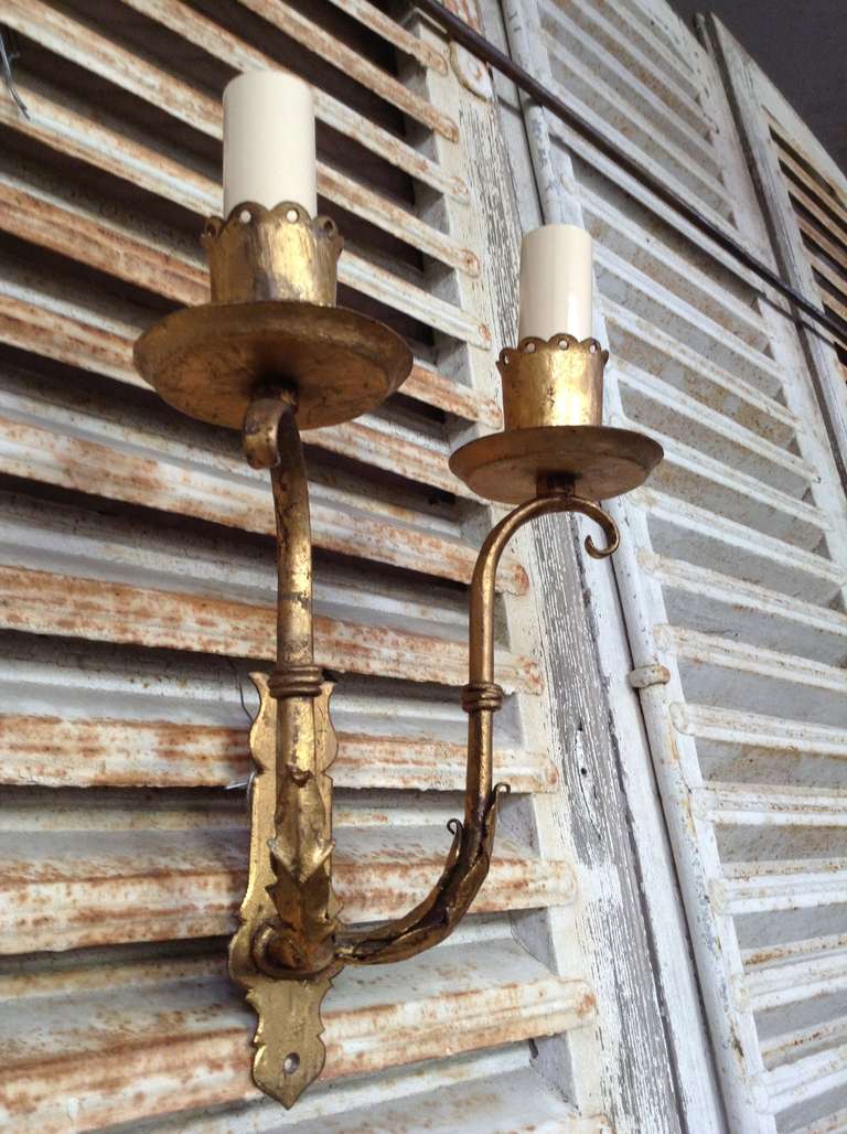 Pr  of Spanish gilt iron 2 armed sconces, sold as is.