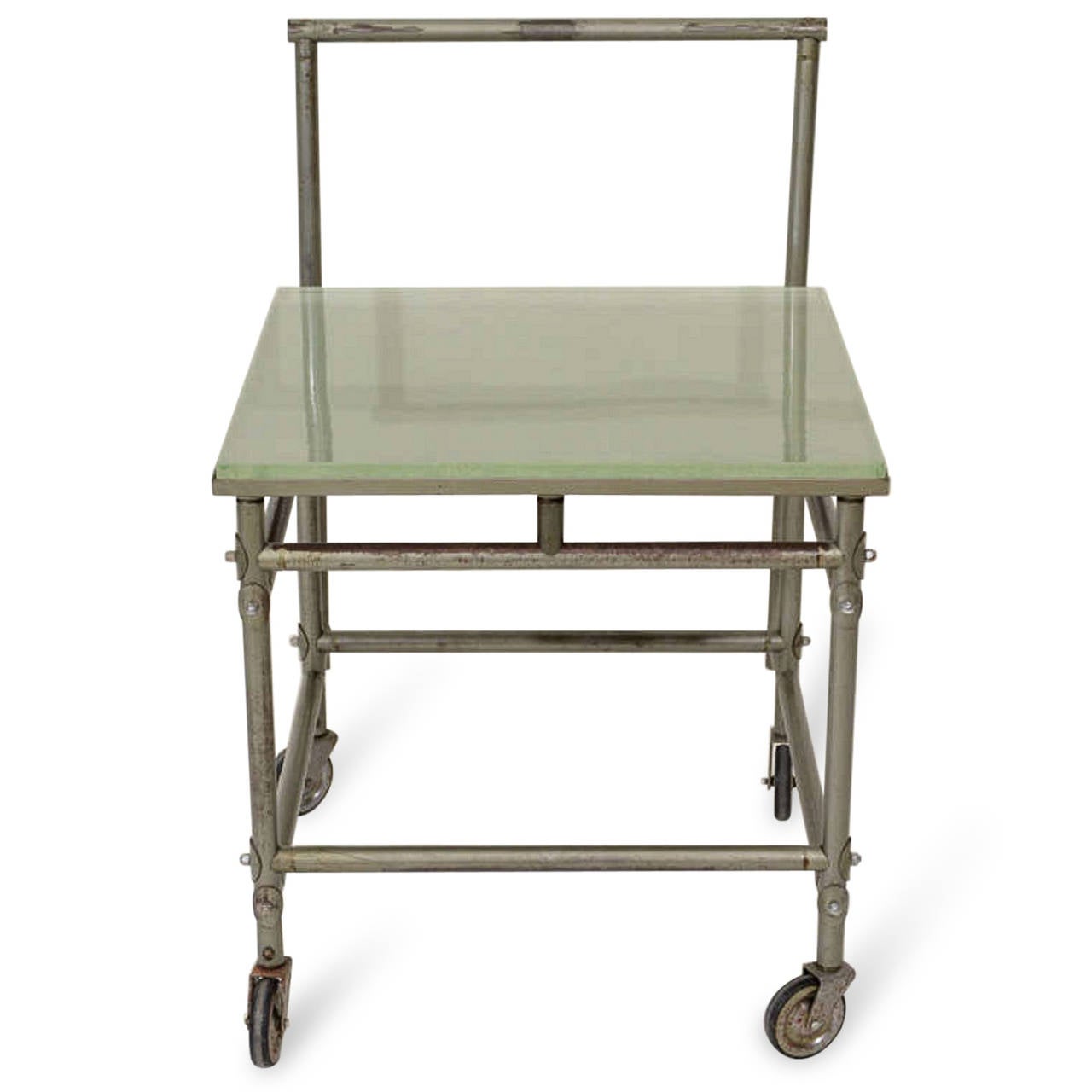 Industrial rolling cart with 1 inch thick St Gobain glass top, on casters. By Rene Herbst, French 1930s. Width 21 in, depth 24 in, height 31 in.

WINTER SALE - 40% OFF - One Week Only !!

(Price shown is reduced price, no further trade