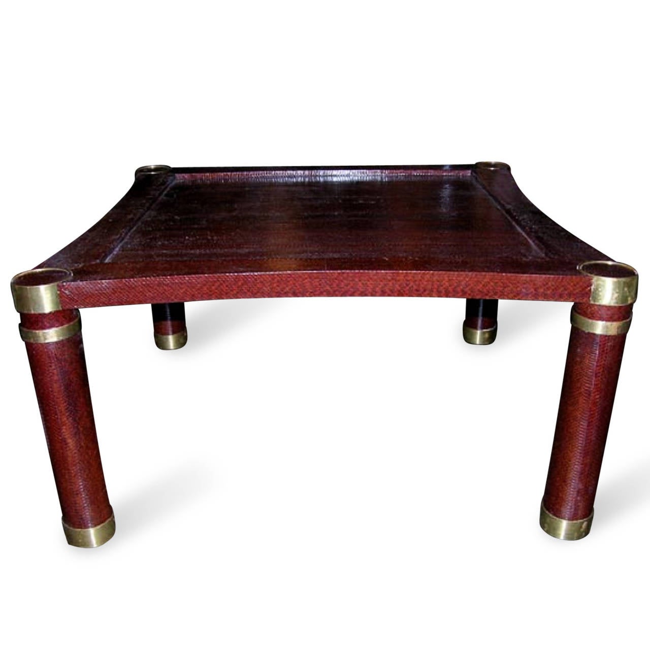 Square occasional table in bronze, covered in reddish/brown snakeskin, cylindrical legs, with bronze caps and sabots, by Karl Springer, American 1960s. 36