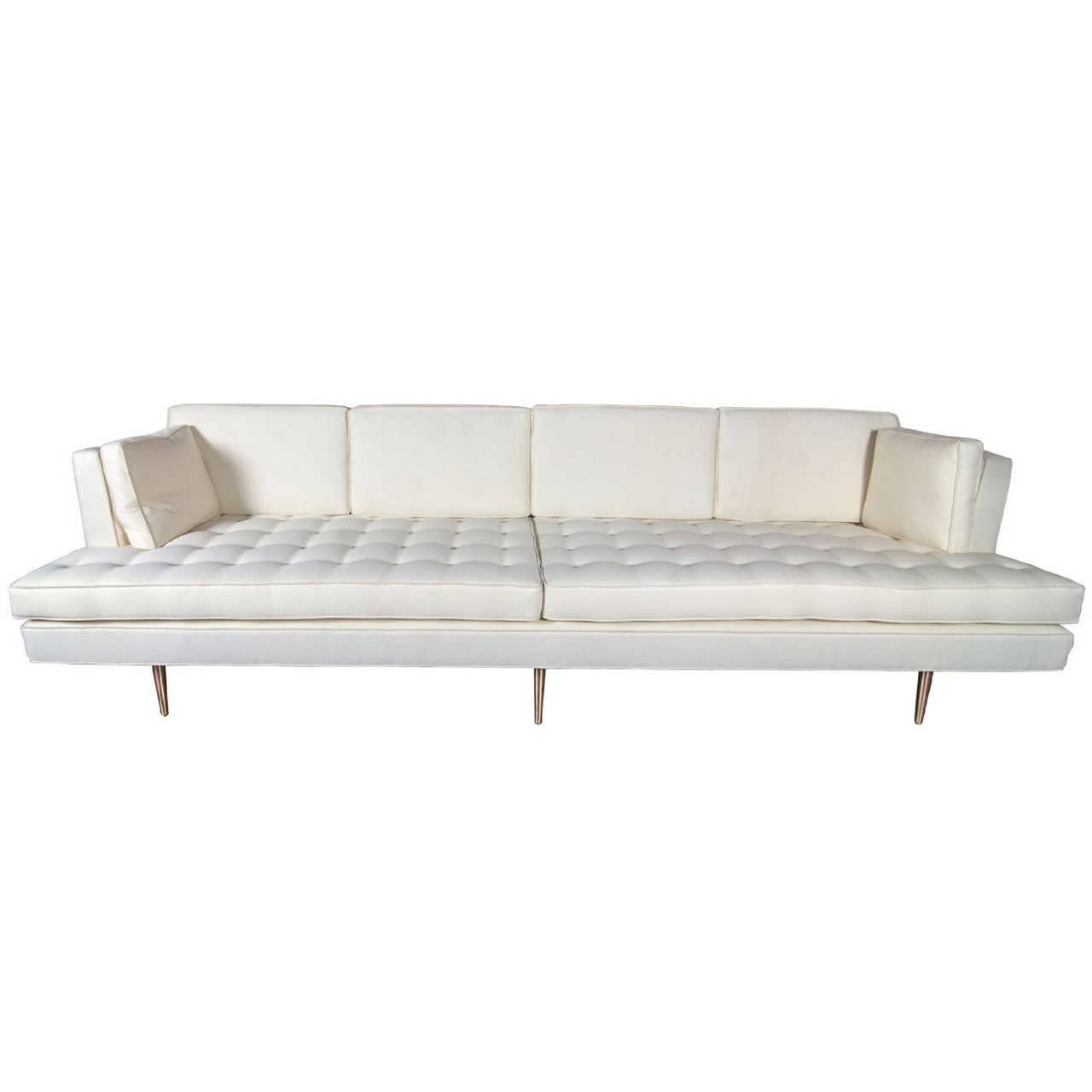 Long, low upholstered sofa with tufted seat, and bronze legs. Designed by Edward Wormley for Dunbar, 1950s. Length 110 in, depth 34 in, back height 28 in, seat height 17 3/4 in.

WINTER SALE - 40% OFF - One Week Only !!

(Price shown is reduced