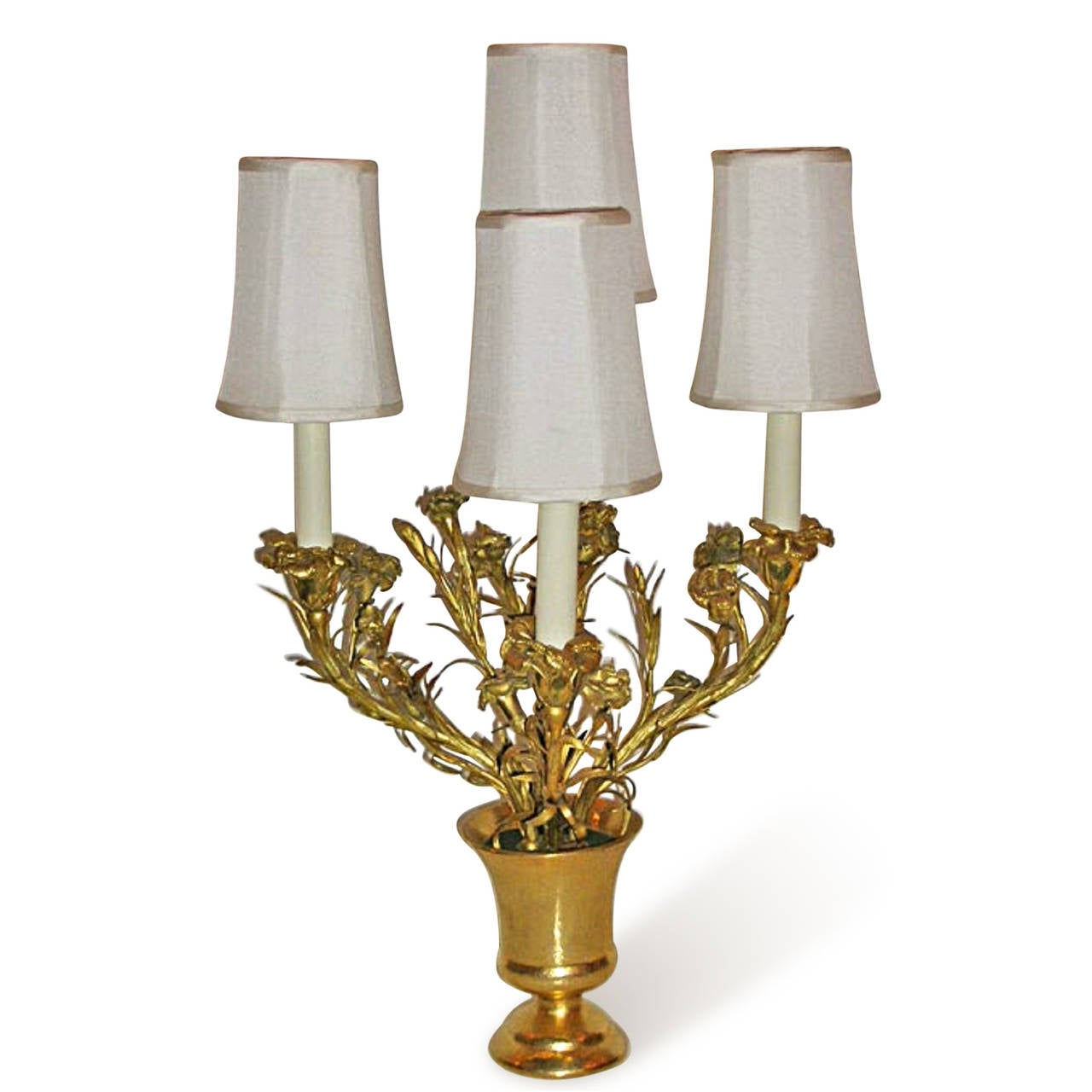 Pair of four-arm gilt bronze flower and pot form lamps, French late 1940s. In custom silk shades. Measures: Height 24.25 in, width 14.5 in, depth 8.5 in.