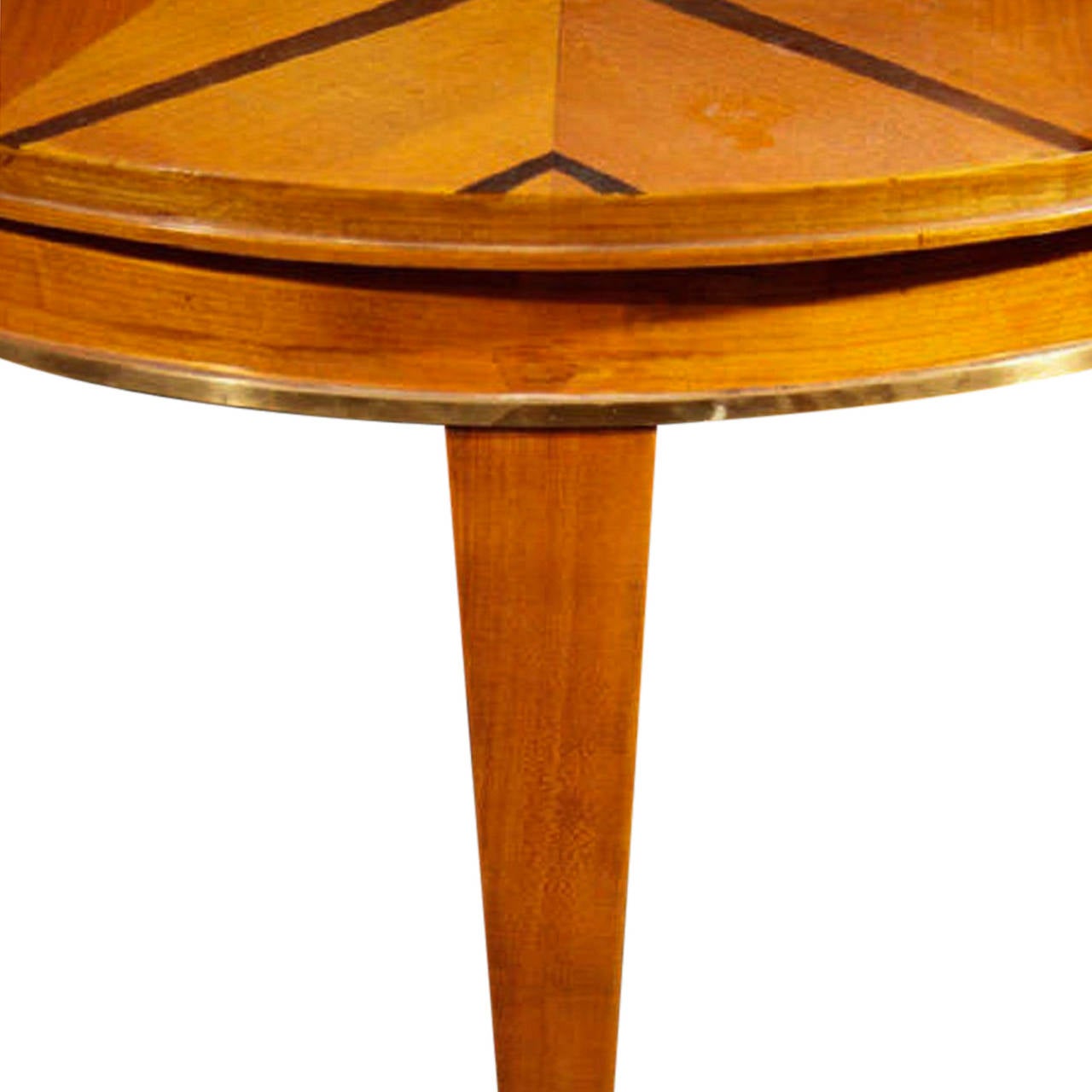 Sycamore circular center table with dark stained starburst pattern created with dark rosewood inlay, tapered legs and bronze sabots by Dominique, French, 1930s. Measures: 41 ½" diameter, 28 ½" height.
 