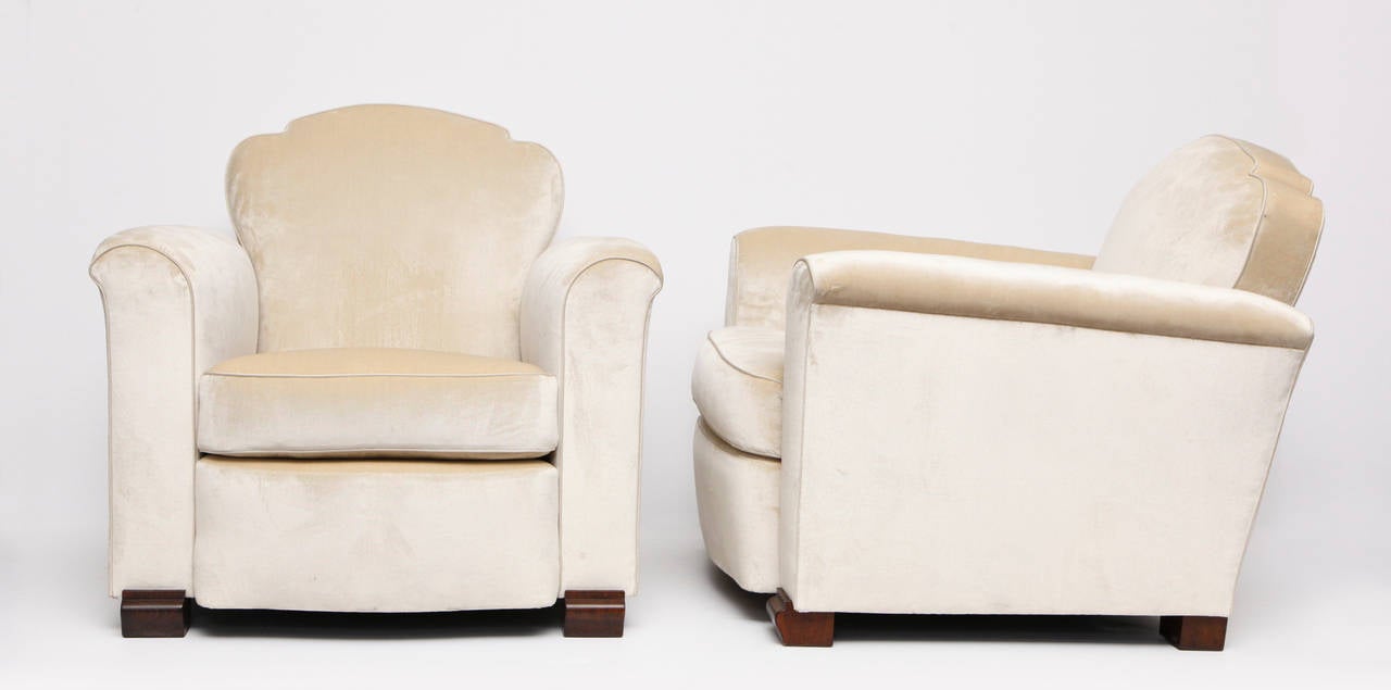 Pair of Art Deco club chairs by Jules Leleu with mahogany feet 

Provenance: These armchairs, along with their matching sofa were purchased directly from Mr. and Mrs. Rosenthalis. This same style of armchair was also owned by the Comtesse Douieb