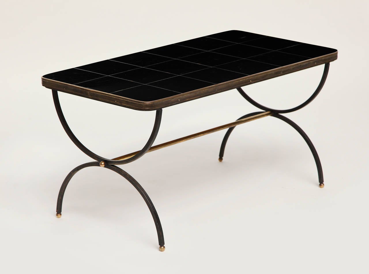 Coffee table by Jacques Adnet with original ceramic tile top by the Compagnie des Arts Français (CAF). Brass base