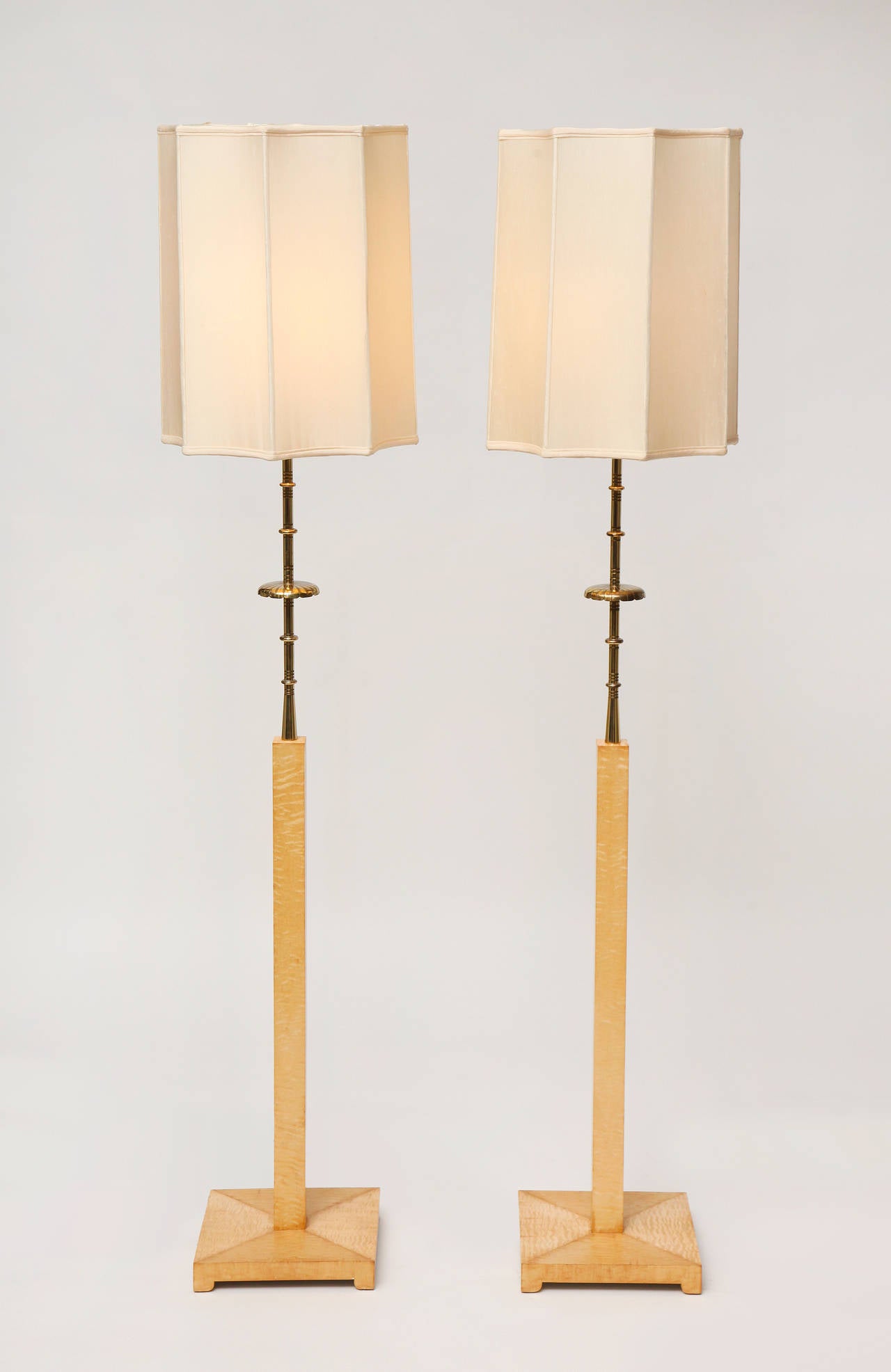 Pair of curly maple and brass floor lamps by Tommi Parzinger, with original silk shades.

This floor lamp was custom designed for the Appleman Commission.
