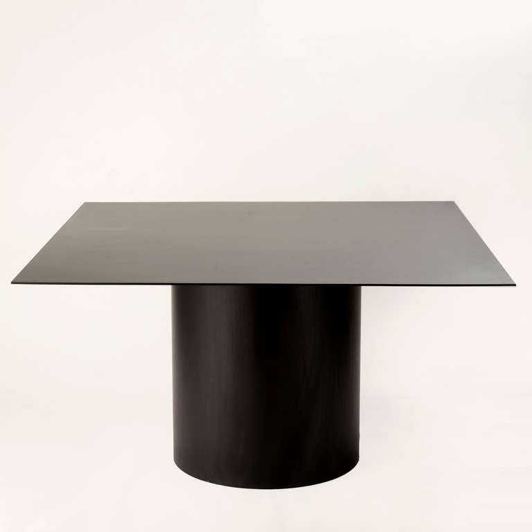 MR.01

Fabricated in 1/4 in. thick blackened steel, this Minimalist dining table is characterized by simplicity of form and material. The design seeks to convey the dynamic relationship between the plane and the cylinder in an expression of