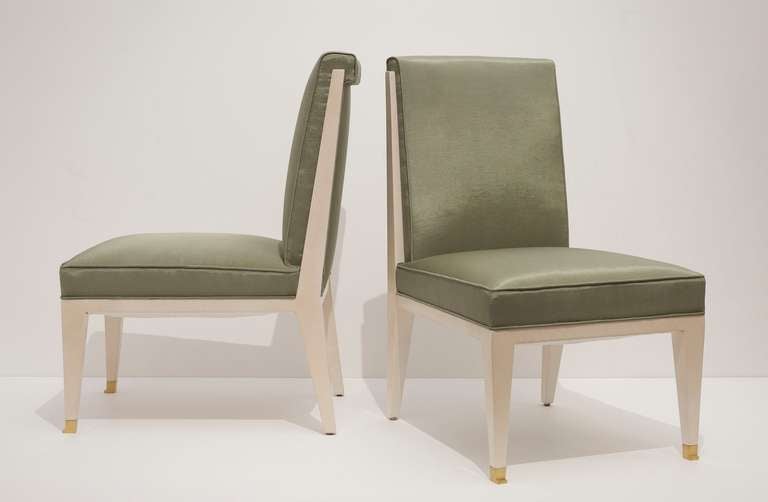 A fine pair of Jacques Quinet slipper chairs in parchment toned lacquered wood with bronze sabots

A similar pair of chairs is shown in Jacques Quinet by G. Maldonado, Paris, Les Editions de l’Amateur, 2000, p. 90