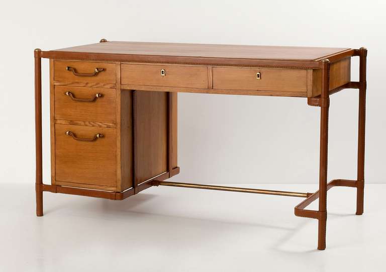Fine oak desk with leather wrapped frame by Jacques Adnet.