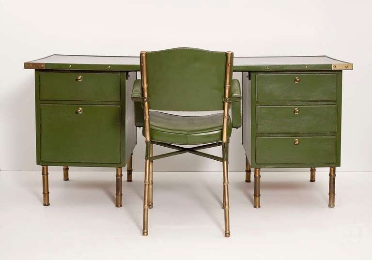 Fine and rare leather and brass desk and armchair by Jacques Adnet

Desk Height: 29.5