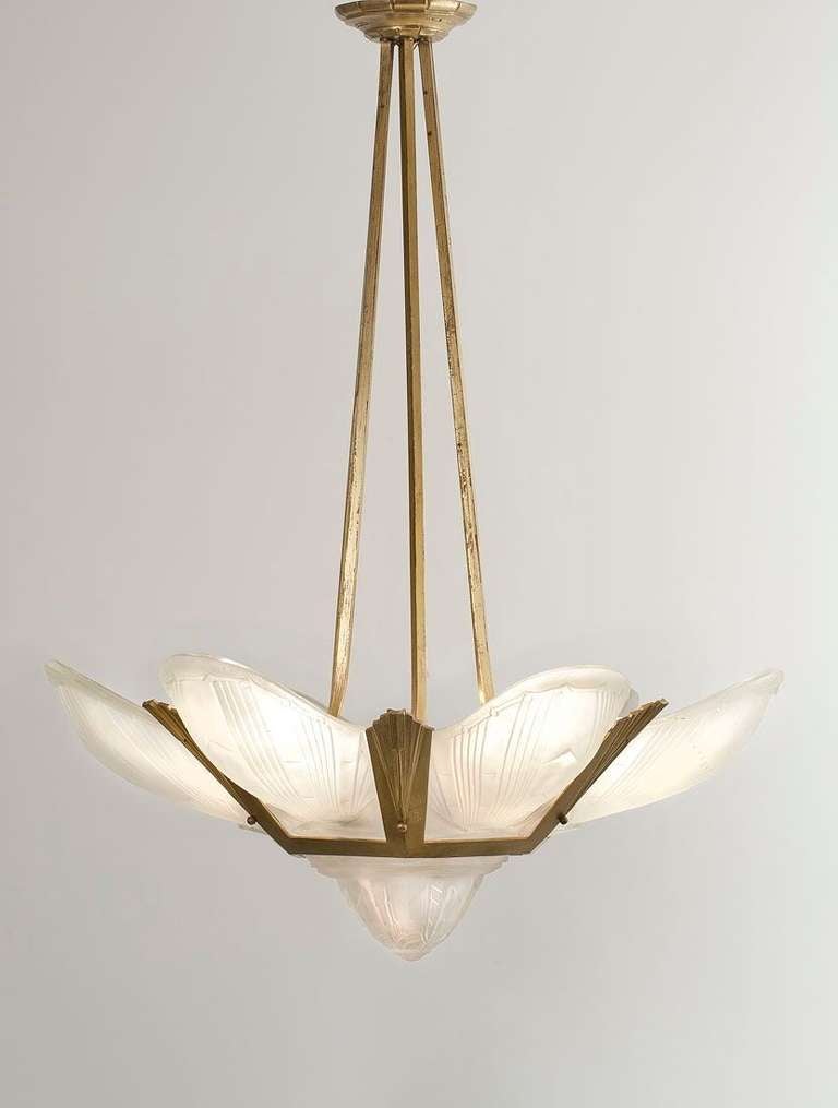 An early Art Deco chandelier in molded glass and gilt-bronze