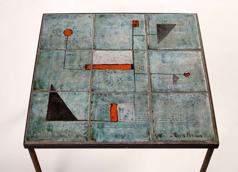 A ceramic tile top side table with a wrought iron base, by Les Deux Potiers (Robert Charlier & Pierre Langlé)

Signed "Les 2 Potiers"
