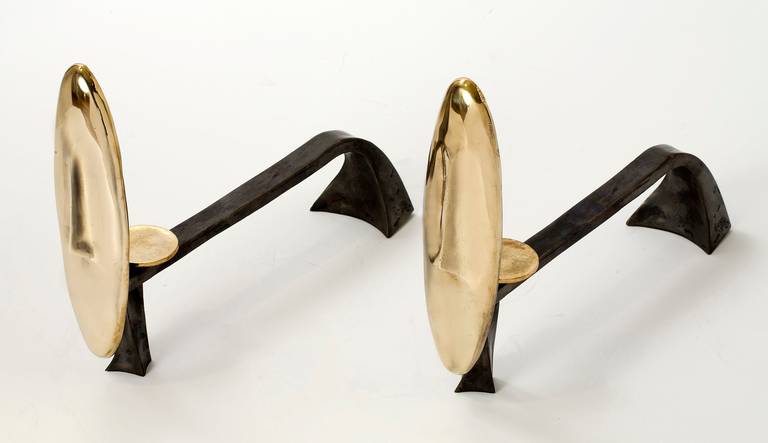 "Ares" pair of gilt and patinated bronze andirons by Aldus.

Gilt and gunmetal patinated bronze andirons.

Edition of 100.
