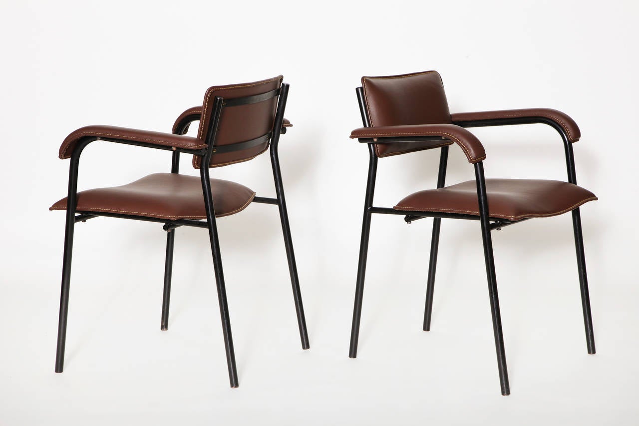 Set of six armchairs by Jacques Quinet. Leather upholstery and metal structure.