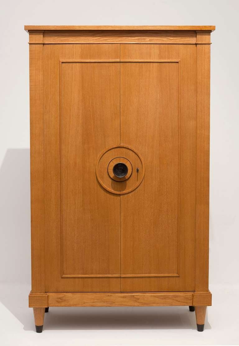 A fine Art Deco armoire in ashwood  with an iron doorknob and sabots by André Frechet

Provenance: 
Commissioned in the late 1940's by the general manager of Sabena Airlines.
Galerie Chastel - Maréchal, Paris
Private Collection, Texas, USA