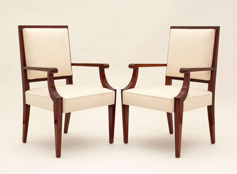 A pair of mahogany armchairs.