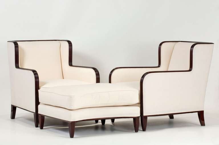 Duchesse brisée- pair of carved mahogany armchairs with matching ottoman/ stool- by René Joubert and Philippe Petit for DIM

Ottoman/ stool: Height: 15.25