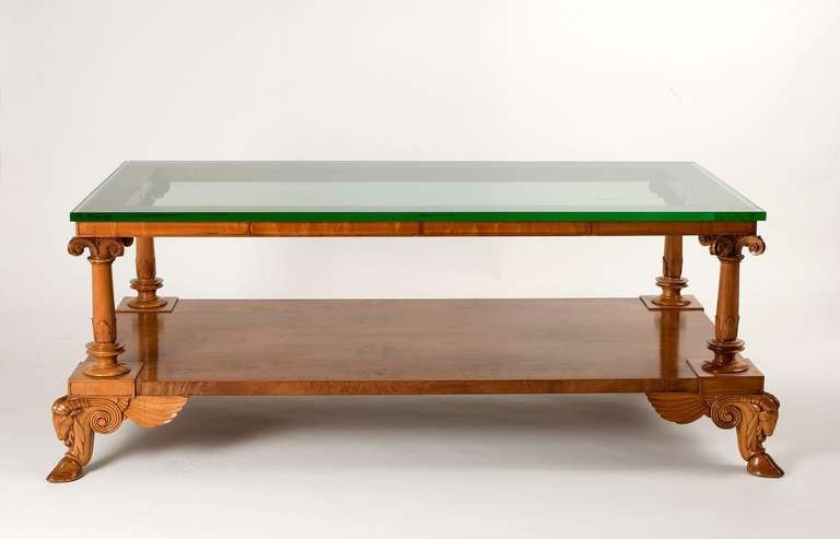 Fine and rare coffee table by T.H. Robsjohn-Gibbings in carved acacia wood with original glass top

Stamped: Sans Epoque, Robsjohn-Gibbings

Provenance: This table was created for the Brentwood, CA home of architect James Dolena. Dolena and
