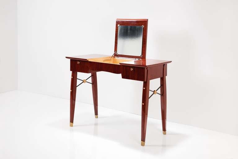 Mahogany writing table or vanity by Jules Leleu with its original mirror, and patinated and gilt bronze details

Signed 