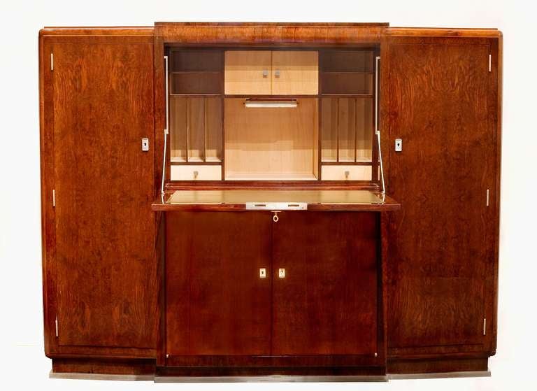 Art Deco drop front secretary / cabinet in French walnut with nickeled bronze ornaments by Jules Leleu

Provenance: A residence near Pau in the Pyrénées, southwestern France.

For illustrations of identical models, see:
Art et Décoration, July