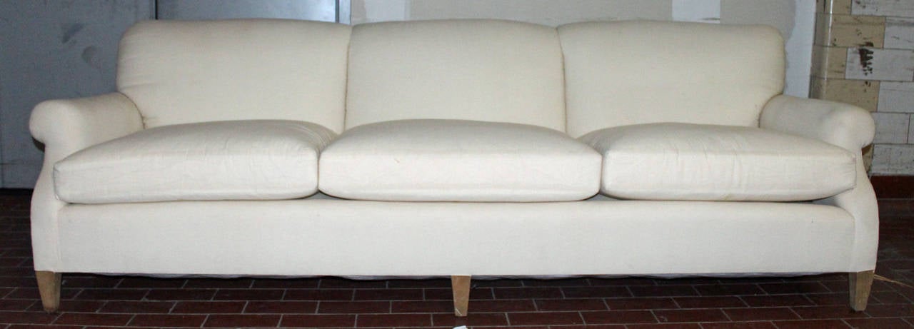 Gracious and comfortable, fully refurbished sofa in muslin. Measures: 96” x 37” x 30” arm height is 23” seat height is 18 ½”.