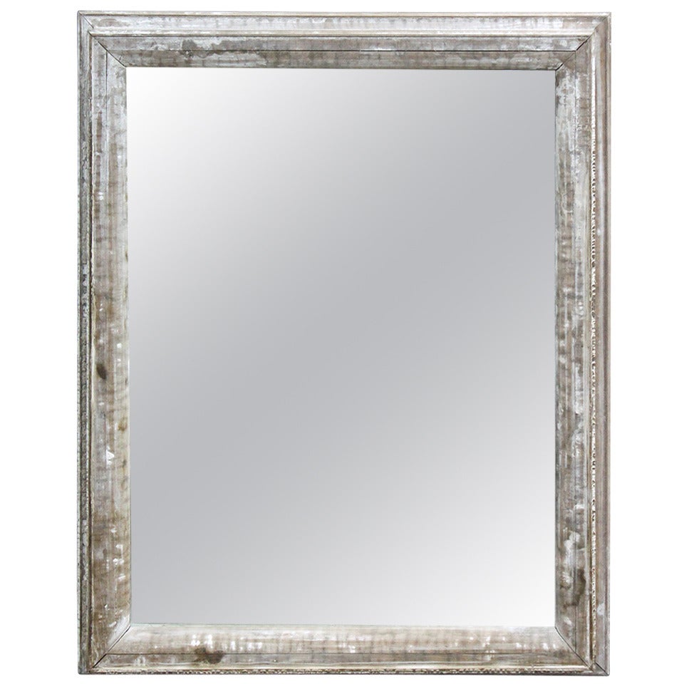 Grand miroir ancien encadré en bois vieilli avec cadre