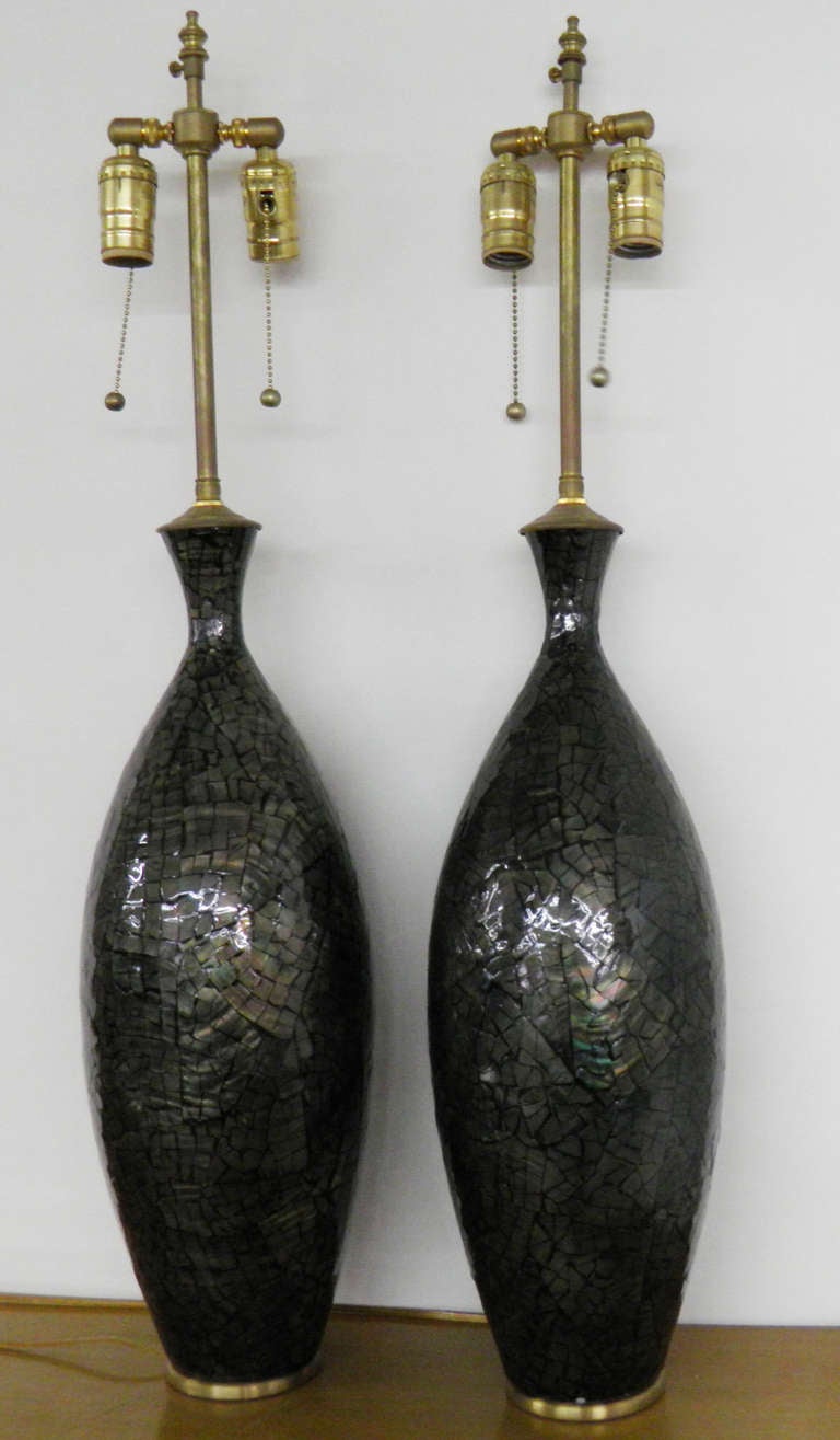 Large and unusual iridescent vases with lamp application. The lamps are set on solid, brushed brass plinths. The shade mounting post extends an additional 3