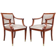 2 Neo-classical Mahogany armchairs with custom brass sabots.