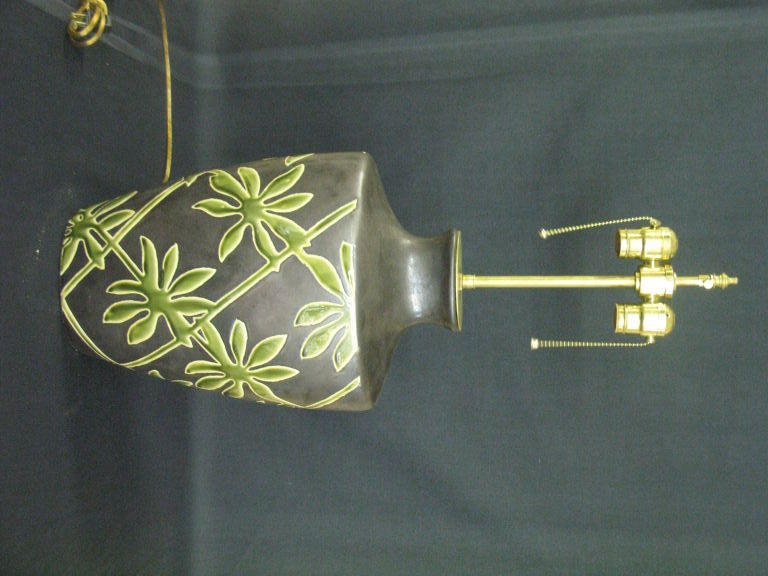 Pair of Botanical fire glazed vases with lamp application. Dual sockets with brushed brass hardware including a center post that can be extended an addition 3