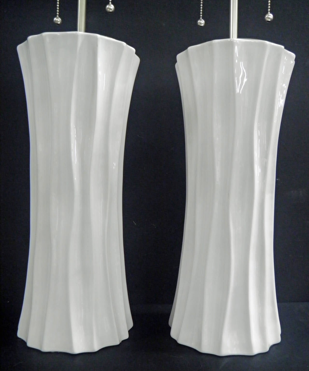 Pair of hand formed fluted ceramic, glazed column vases with lamp application. The vases are 16 1/4
