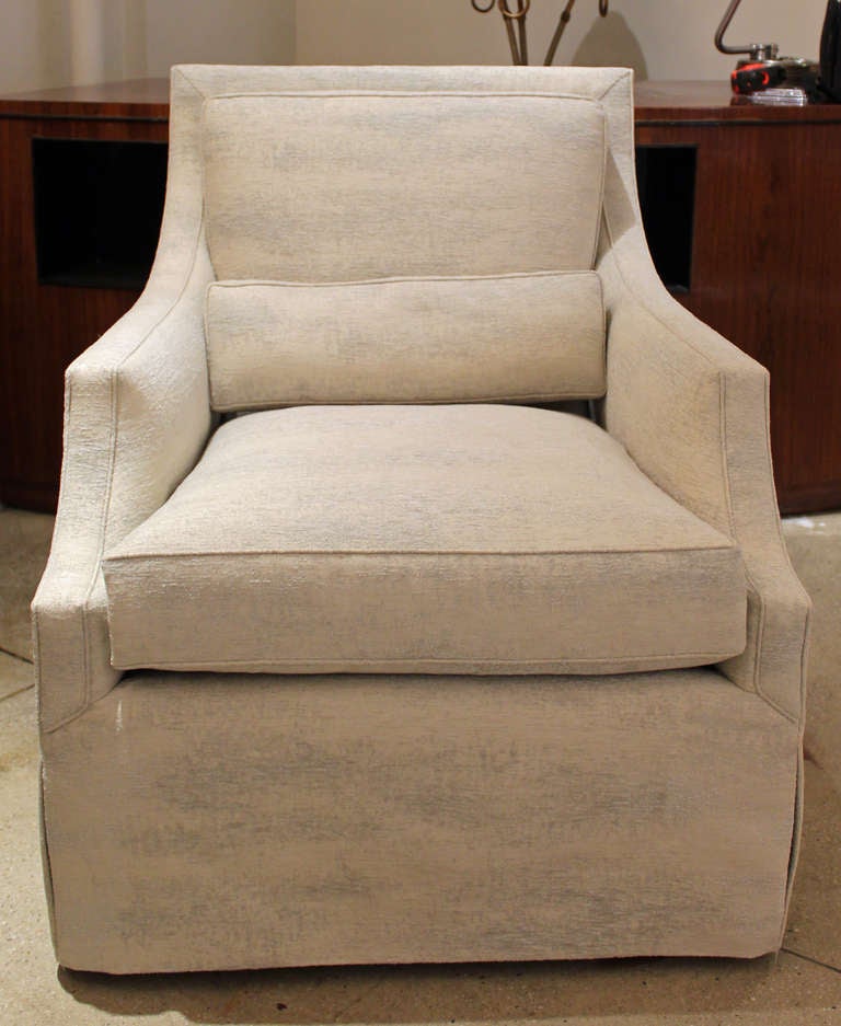Elegant and comfortable club chair in a pale blue and white 