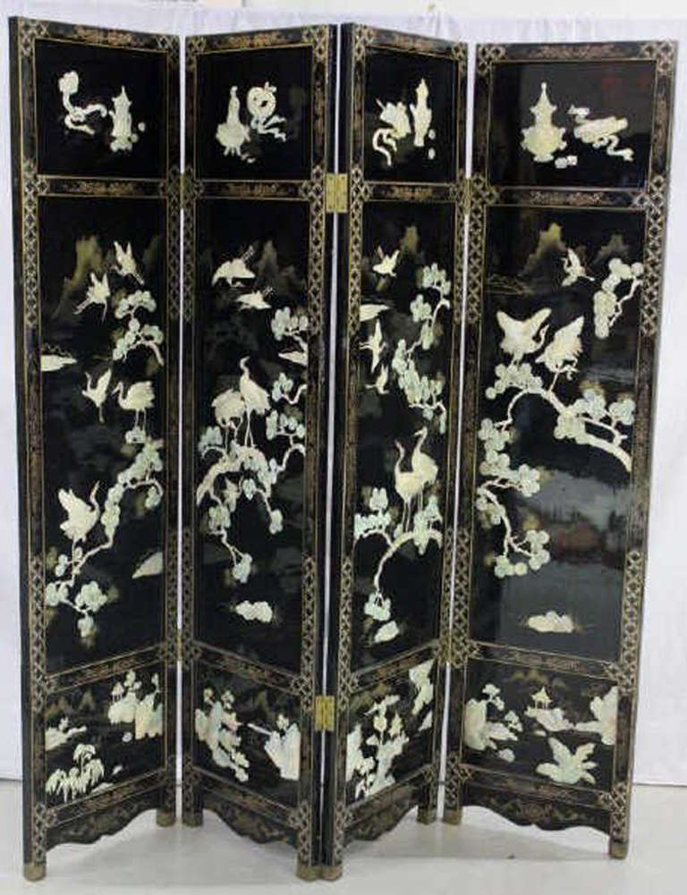 Finely detailed Vintage Chinese Lacquer screen with Mother of Pearl and Alabaster inlays highlighted by hand painted details in gold.  The screen has footed brass sabots.  The back is also beautifully detailed.