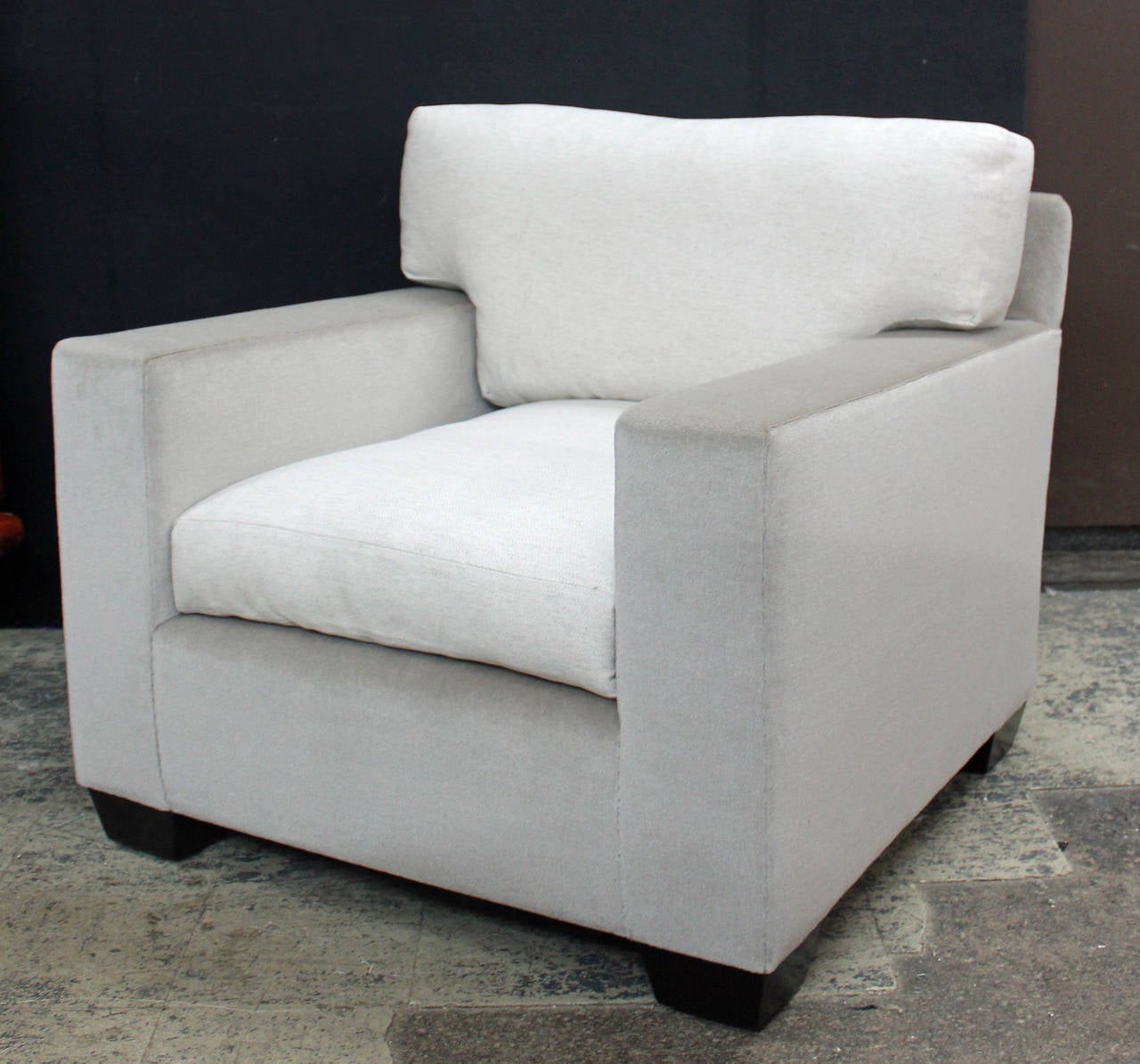 Pair of fully refurbished JMF style club chairs. The bodies are upholstered in a platinum silk mohair, the seat and back cushions are in a platinum and off-white linen. The feet are finished in a satin Espresso. The seat composition is down/down