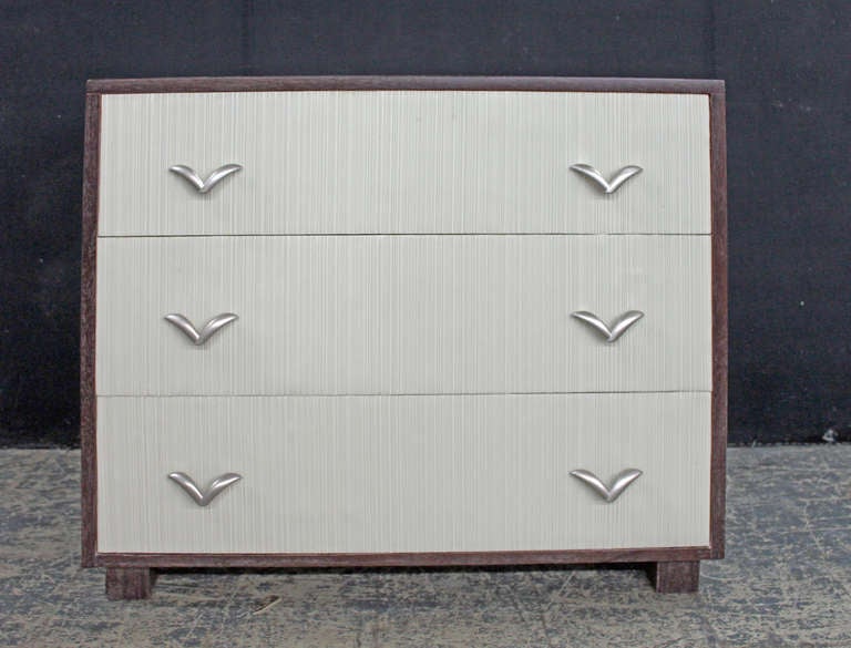 Fully refurbished pair of vintage cerused mahogany dressers with corded vinyl drawer faces and satin nickel pulls.