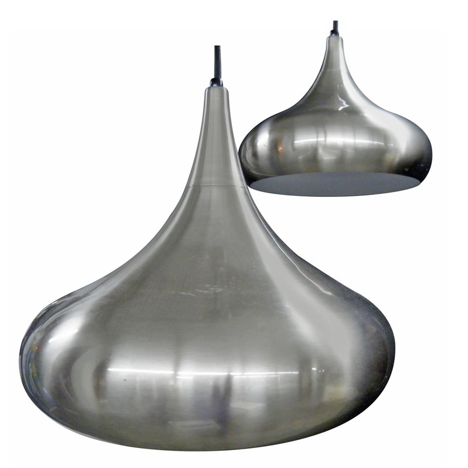 Pair of Brushed Stainless "Kiss" Pendants For Sale