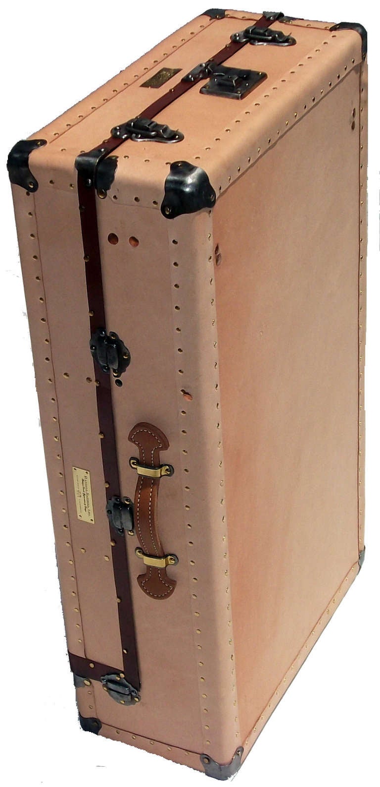 These scaled-down versions of wardrobe trunks from the 1940’s offered ample space to pack for shorter trips.  Recovered in vegetable tanned leather and lined in black cotton velvet. Inner 2 chamber storage compartment with hinged lid, secured by