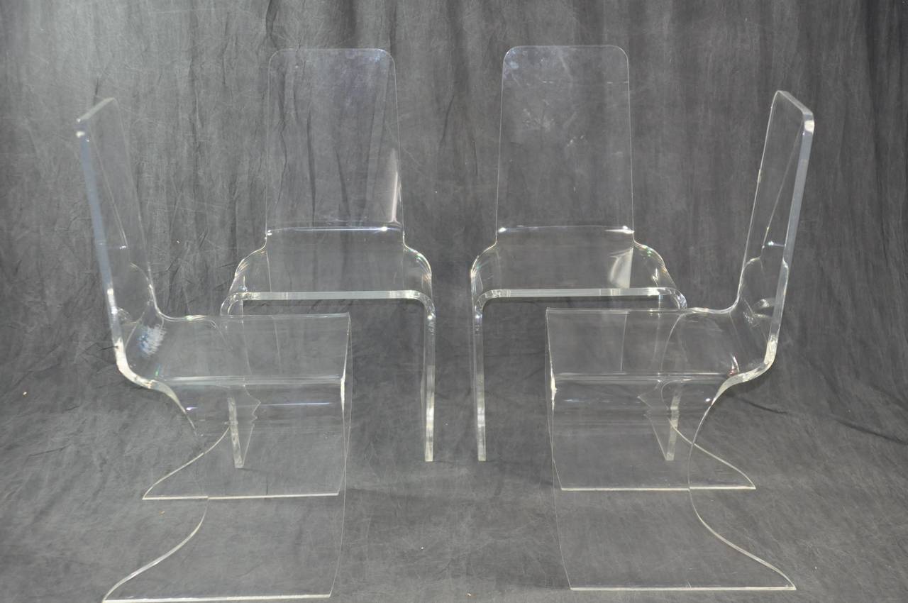 Set of Four Exceptional Vintage Acrylic Dining Chairs with Unusual Curved Bottom Design
From Miami
