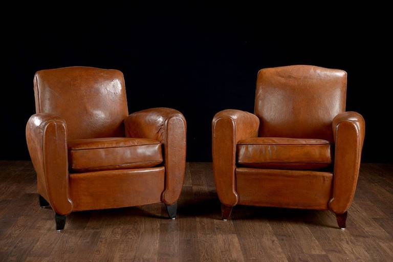 Pair of Vintage Leather Club Chairs with Interesting Arm Details and Nail Heads on Back