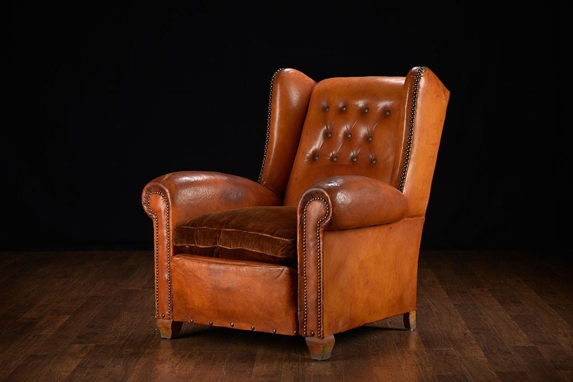 Pair of Vintage French Leather Tufted Wing Chairs