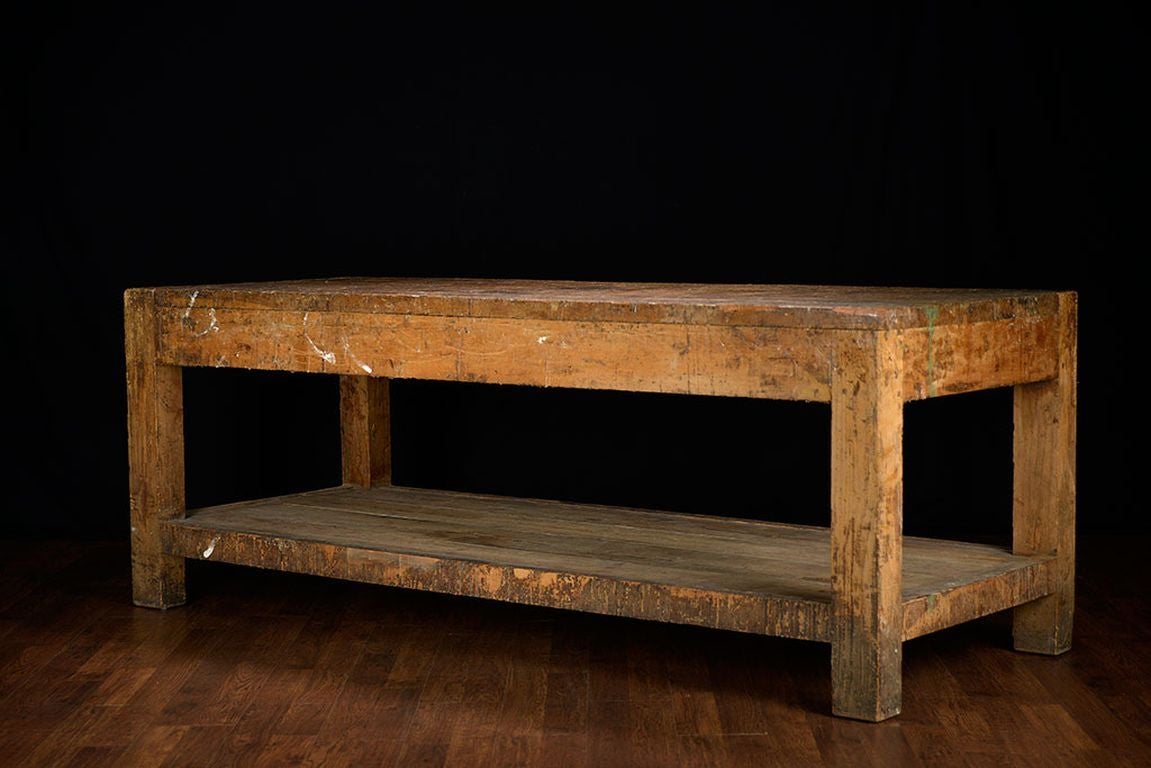 Antique Italian oak factory work table with bottom shelf.