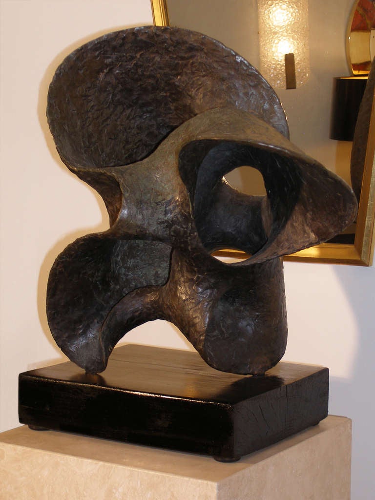 A textured abstract bronze with incredible patina from the Oceania Series.

Resting on a blackened wood base by Seena Donneson.

American, Circa 1962

(Avnet-Shaw Foundry) 

The sculpture is signed by the artist and unique.

This sculpture is in