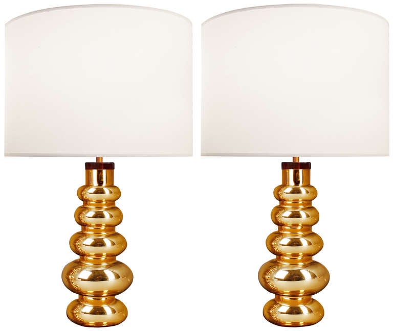 A pair of gold glass lamps by Johanfors.

Swedish Circa 1960's

Lamp Shades Are Not Included.

If you are interested in Lamp Shades, please email The Craig Van Den Brulle Design Team Via Message Center, and we will provide you with a quote.

Lamp