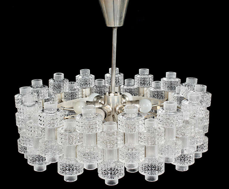 A chandelier consisting of interlocking pieces of glass on a metal frame by Carl Fagerlund for Orrefors.

Swedish, Circa 1950's