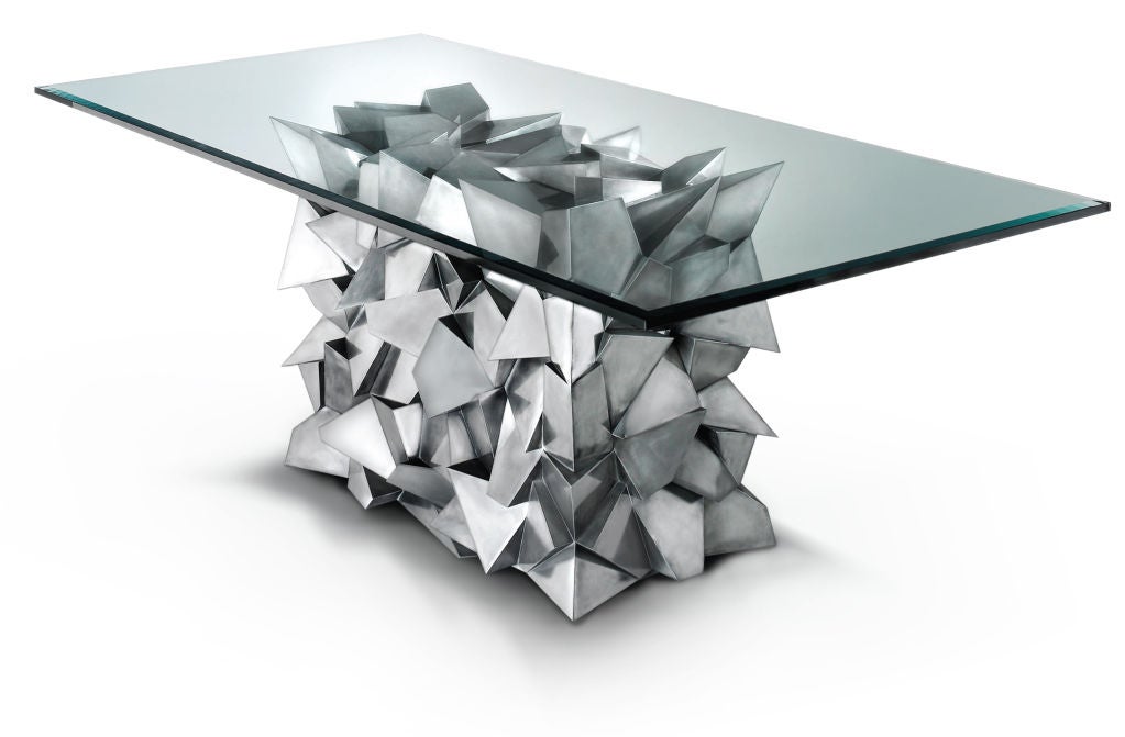 Inspired by the mathematical and computational geometric concept, the Delaunay triangulation algorithm, this distinctive metallic cubist-style dining table stands 84” L x 42” W x 30.5” H. 

A Delaunay triangulation for a set of points in the plane