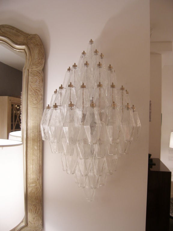 A pair of polyhedral shaped clear glass sconces on metal frames with nickel caps by Venini, Italy, circa 1970s.