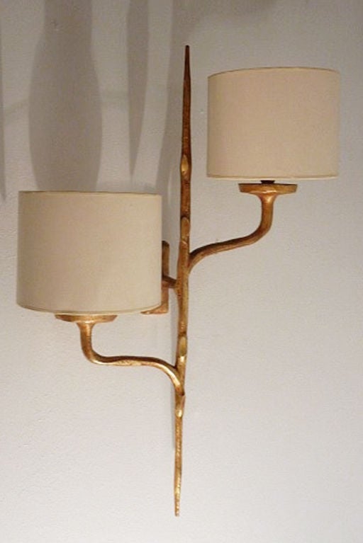 A pair of cast gilt bronze sconces by Felix Agostini, French C.1960's
