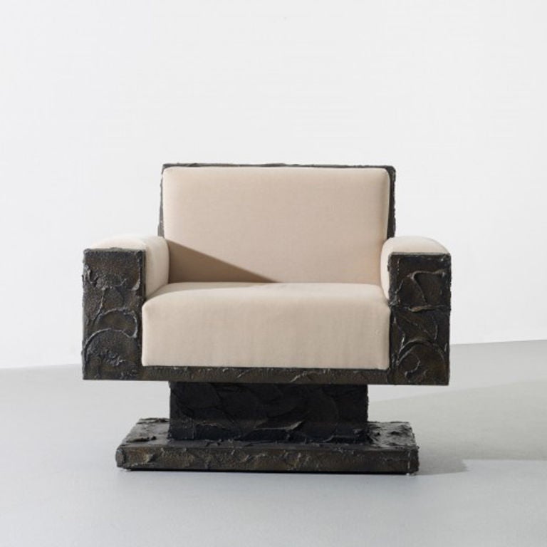 A sculpted bronze over plywood armchair by Paul Evans.

American, circa 1969

This rare armchair is in stock.

This work is unique. This chair was designed for Directional as a part of a flat-sculpted bronze furniture line that was never put